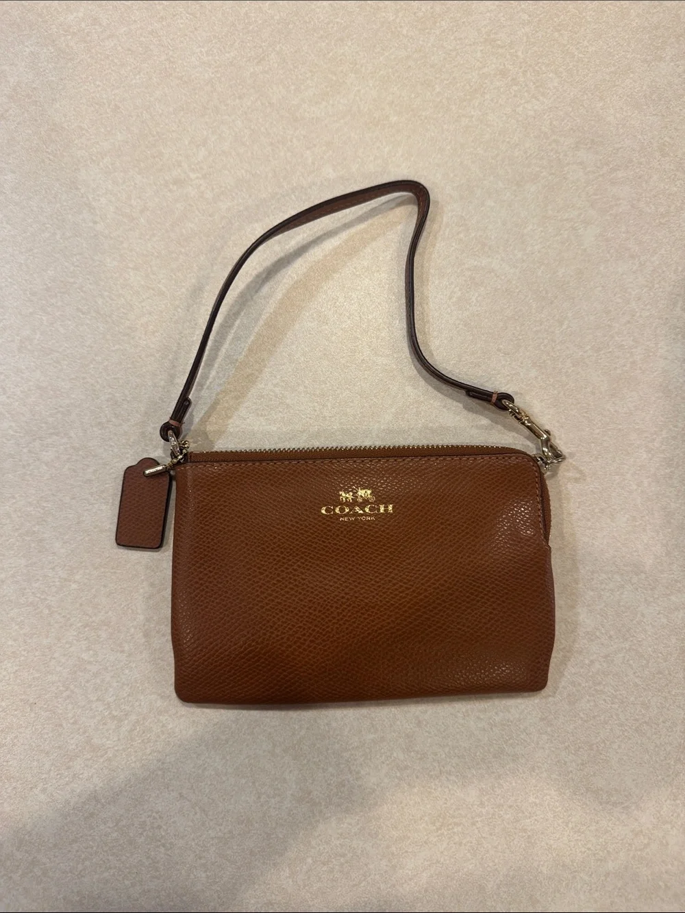 Coach Brown Pebbled Leather Wristlet with Gold Logo